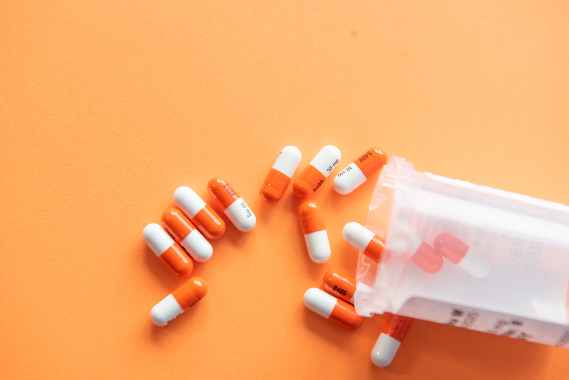 Photo of pills on orange background