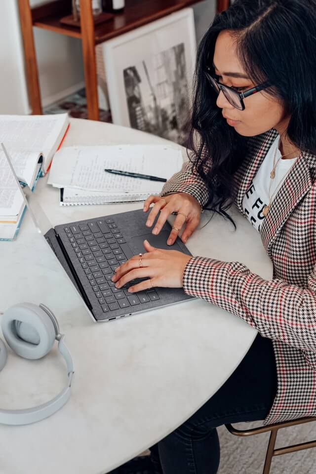 Young woman researching how to safely buy medicine online